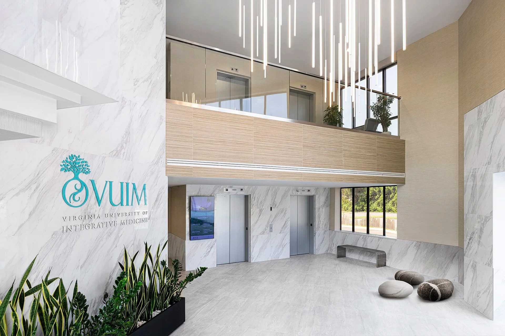 Virginia University of Integrative Medicine lobby with marble walls and pendant lighting